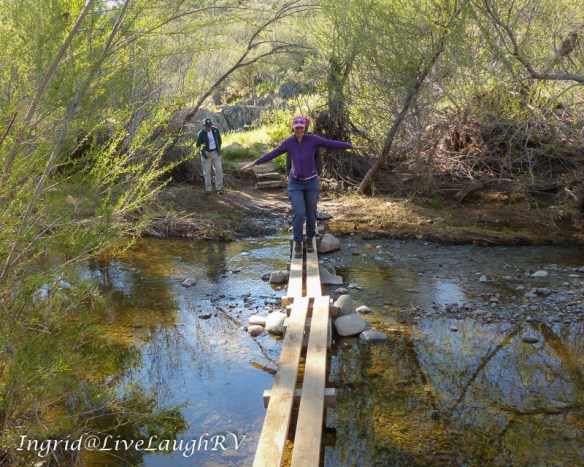 Hiking crossing a creek in Arizona