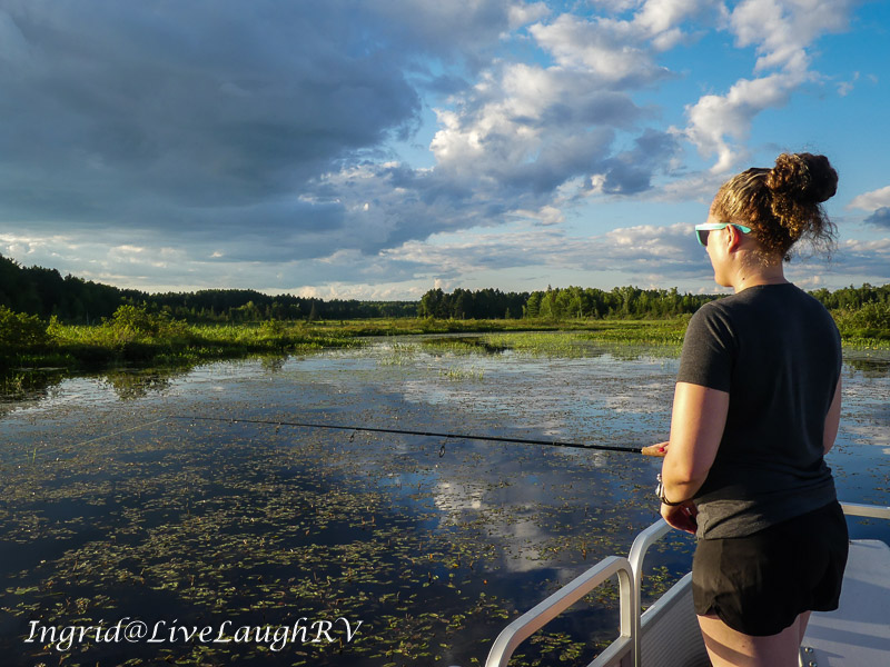 young gal fishing on a pristine lake