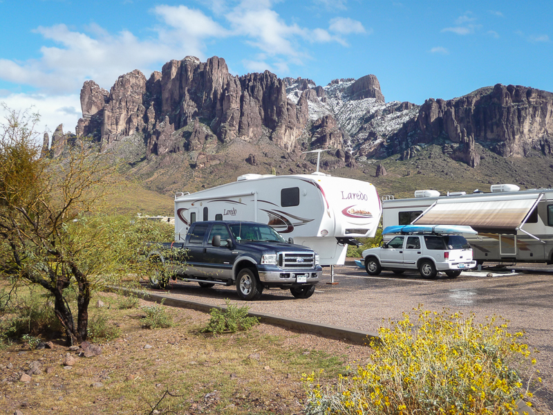 RVs camped at snow covered flatiron at the Superstition mountains